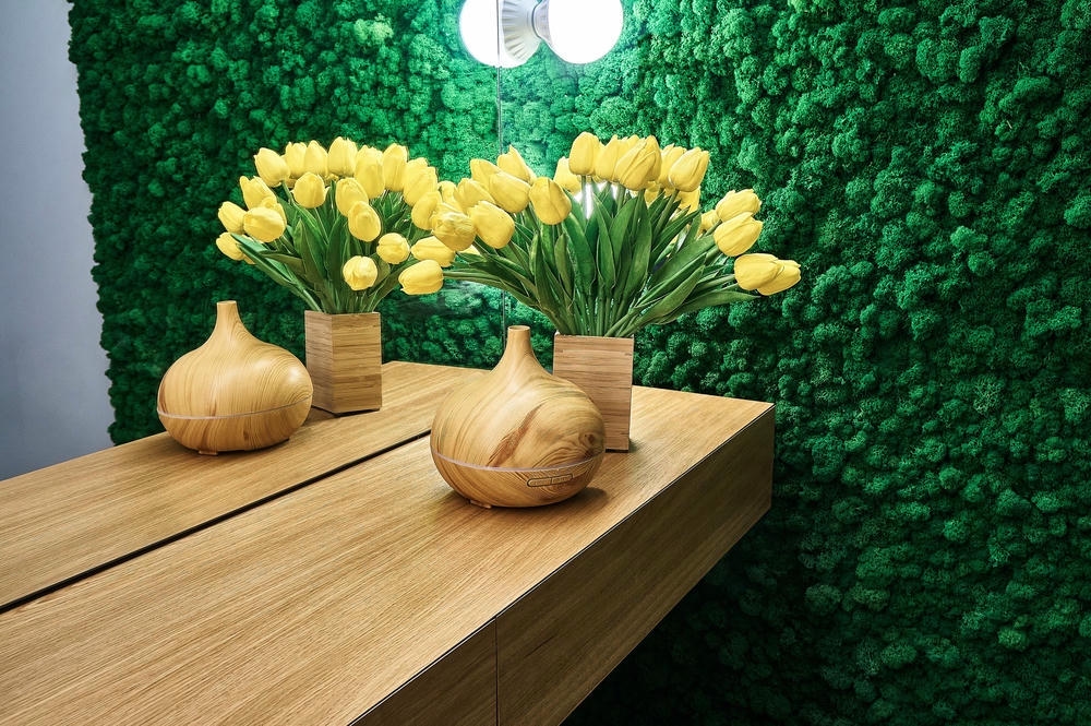 Green moss and yellow tulips in the interior